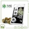 Résine CBD 22 % Lemon Haze en pot avec emballage plastique transparent, marque Plant of Life, accompagnée de fleurs CBD.