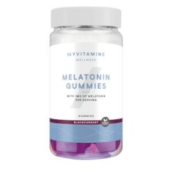 Bocal transparent avec couvercle gris, contenant des gummies violets, étiquette blanche avec texte bleu et violet.